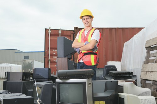 Team efficiently organizing and clearing household items